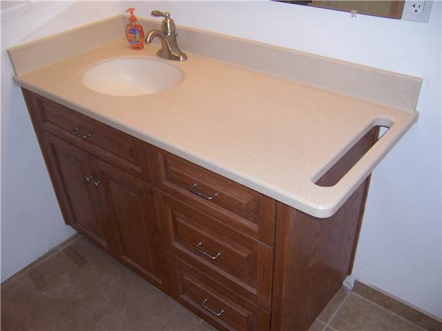 Corian solid surface countertop, undermount sink, and integral towelbar